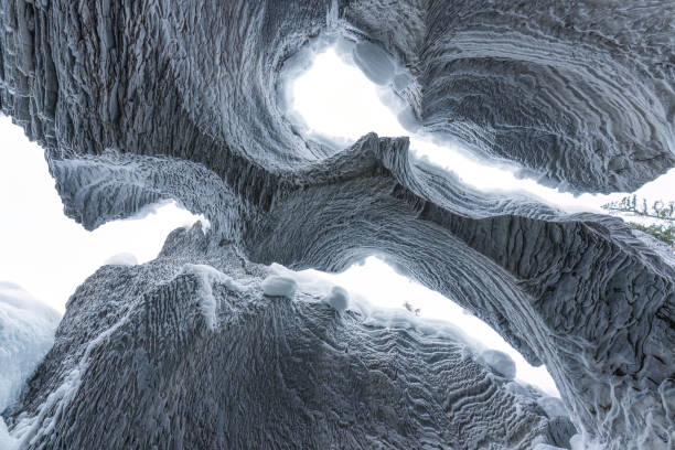 Ice cave with rock formation of water eroded on winter
