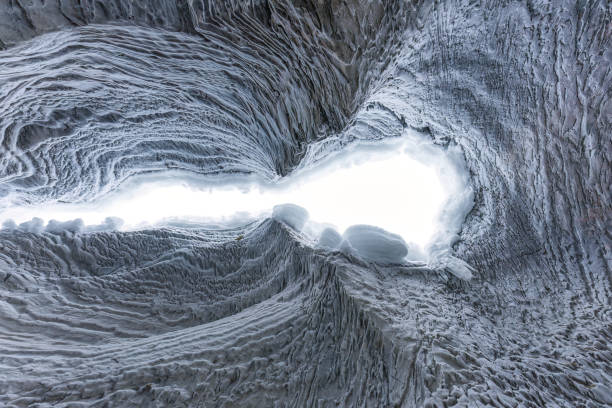 istock Ice cave with rock formation of water eroded on winter 2167940520