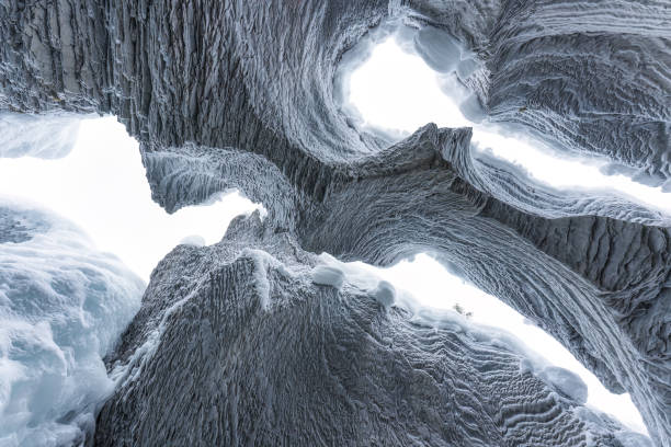 istock Ice cave with rock formation of water eroded on winter 2167940522