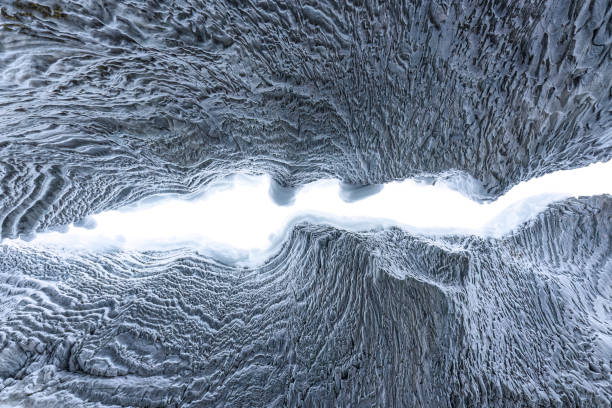 istock Ice cave with rock formation of water eroded on winter 2167940523