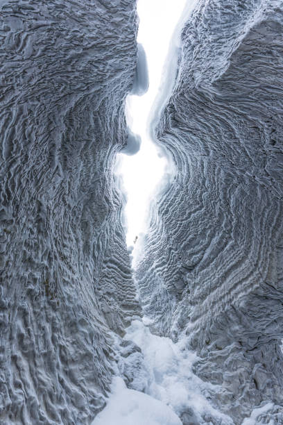 istock Ice cave with rock formation of water eroded on winter 2167940526