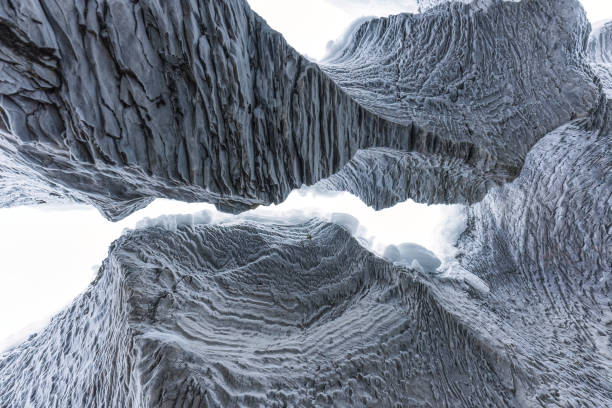 istock Ice cave with rock formation of water eroded on winter 2167940532
