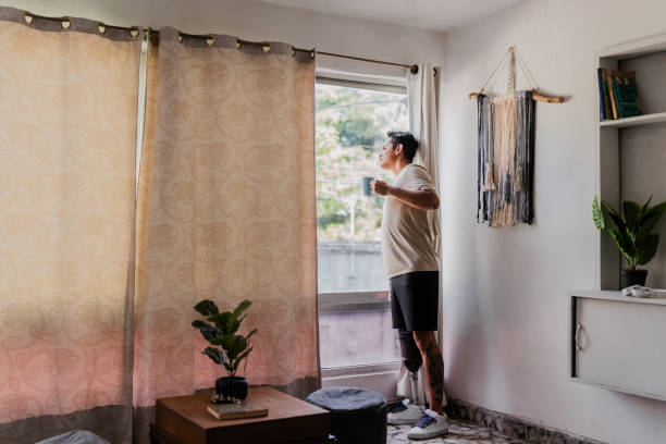 istock Mid adult man contemplating at home 2167941421