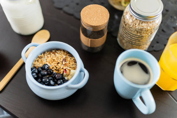 Breakfast with yogurt with granola and bluberry and coffee