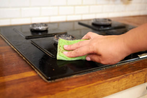 istock the process of cleaning a black stove in a home kitchen 2167942341