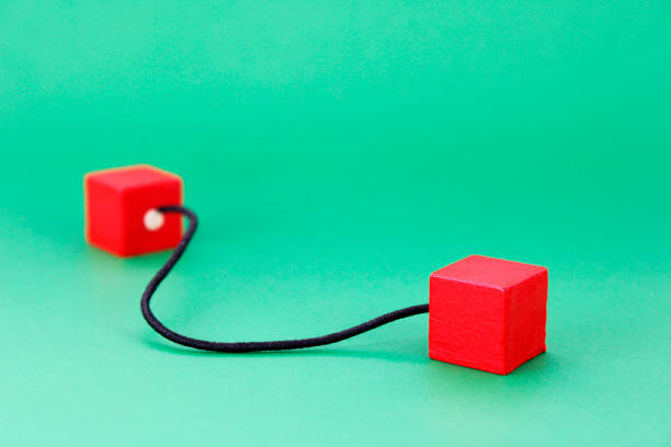 Tied, rope with a wooden cube at each end