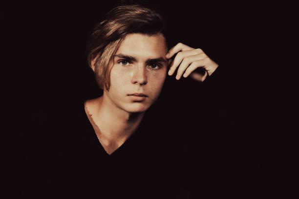 istock A young attractive guy is sad while sitting on a chair. 2167943835