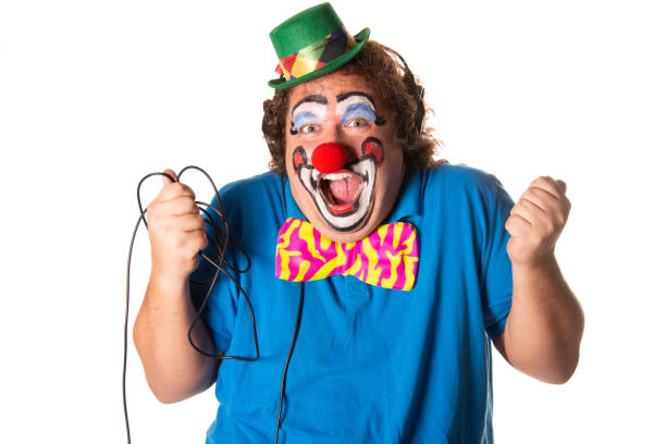 Funny fat clown posing on a white background.