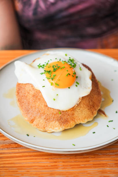istock A plate of pancakes with a fried egg on top 2167943998