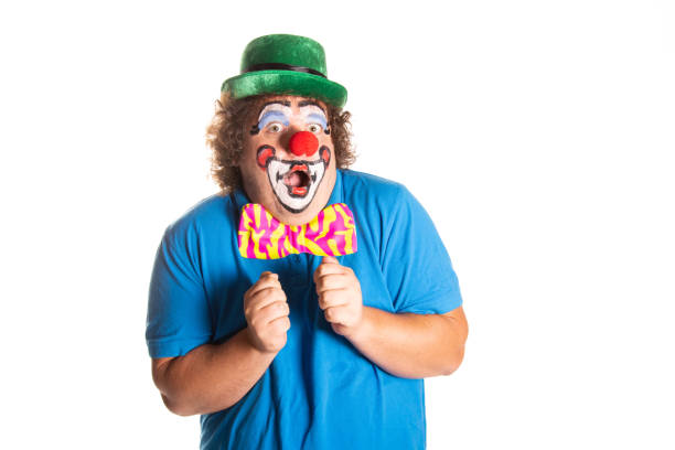 istock Funny fat clown posing on a white background. 2167944122