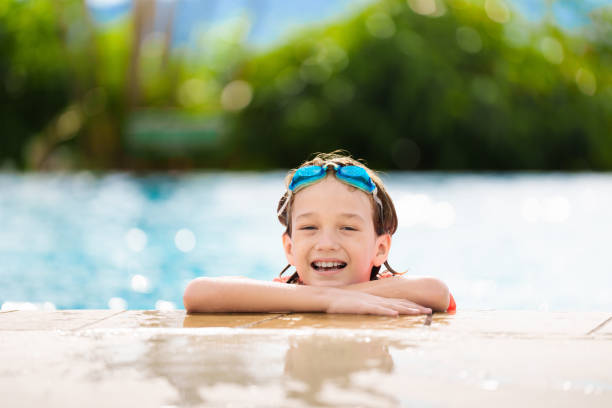 istock Kids jump into swimming pool. Summer water fun. 2167944307