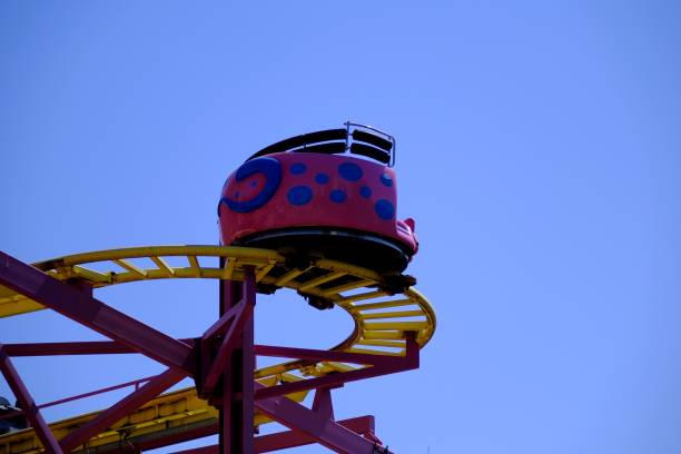 istock Fun Ferris wheel and slides in the amusement park 2167945647