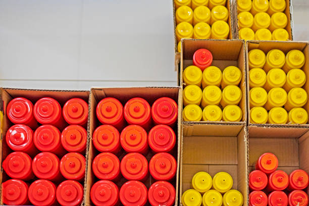 multicolored plastic containers for sauces, mayonnaise, ketchup and other liquids