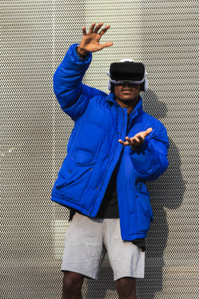 istock Black man experiencing virtual reality in city 2167951740