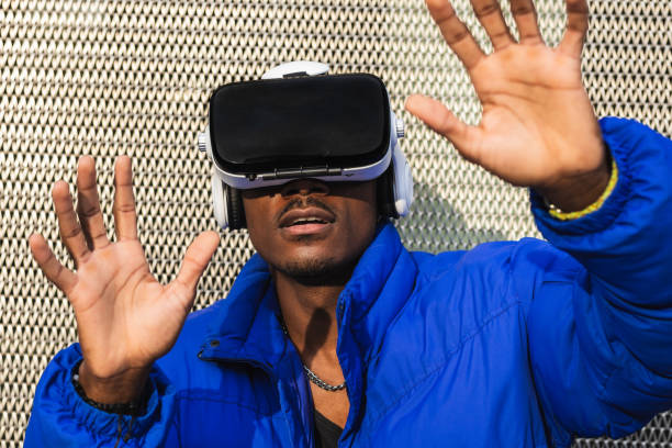 istock Black man experiencing virtual reality in city 2167951743