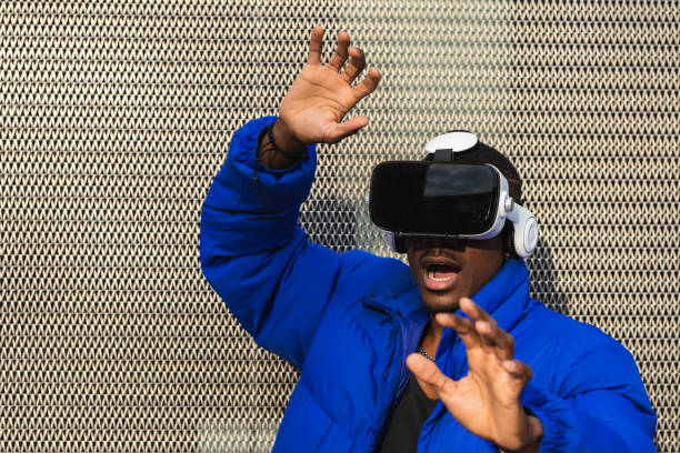 istock Black man experiencing virtual reality in city 2167951749