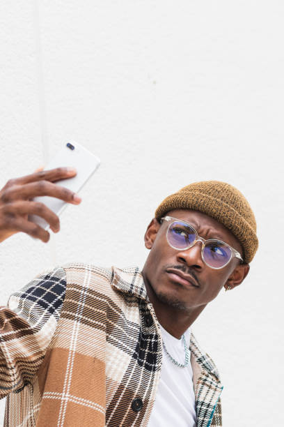 istock Stylish black man taking selfie 2167952114
