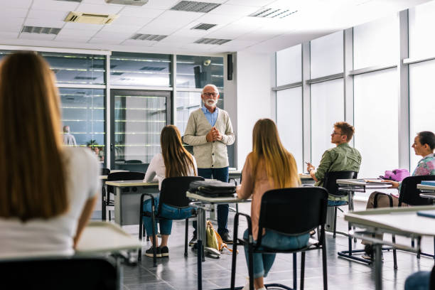 istock Senior teacher teaches a new lesson to his students. 2167952498