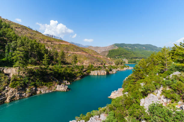 istock Water dam and reservoir river between green mountains 2167953217