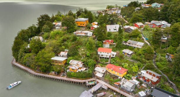 Aerial View of Caleta Tortel in southern Chile, Aysén Region Caleta Tortel is located in southern Chile, Aysén Region. This coastal town lies between the mouth of the Baker River and a Little Baker Dam. carretera austral chile stock pictures, royalty-free photos & images
