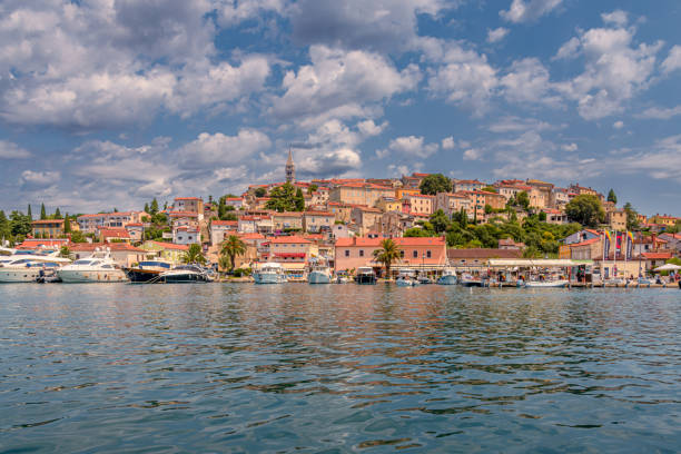 Vrsar, Croatia - July 25, 2024:  view  from the water of the village Vrsar.