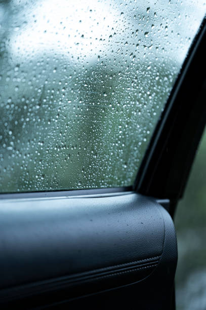 istock Raindrops on the surface of a car window 2167954677
