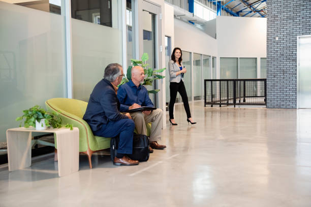 istock Active senior men coming for a job interview in an open work space. 2167959728