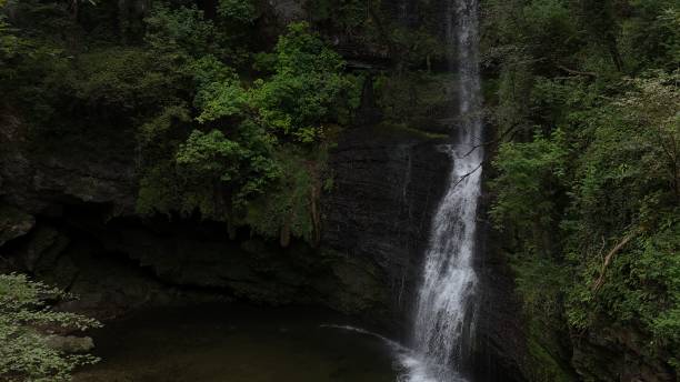 istock little waterfall in the mountain 2167959970