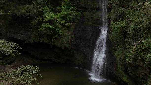 istock little waterfall in the mountain 2167959979
