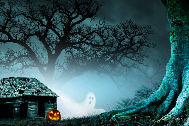 istock Ghost And Jack O'Lantern In Front Of A Haunted House 2167960622
