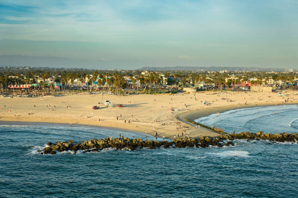 Aerial shot of Venice Beach on a sunny Summer afternoon in Los Angeles, California.\n\nAuthorization was obtained from the FAA for this operation in restricted airspace.