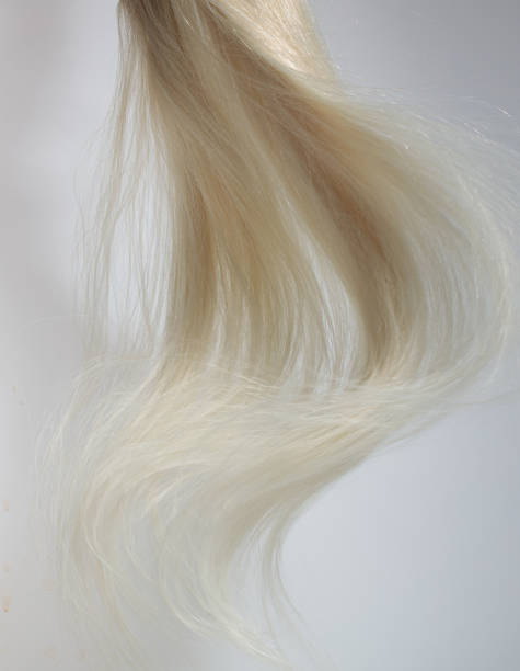 istock blonde hair extensions blowing in the wind 2167963021