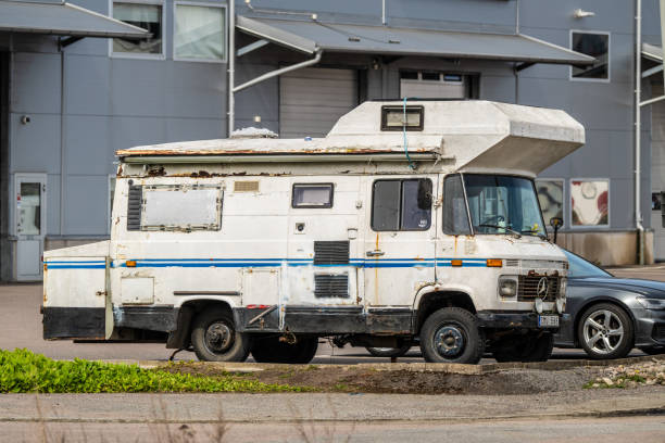 Gothenburg, Sweden - April 30 2024: Worn white 1969 Mercedes-Benz L406 converted into a camper van.