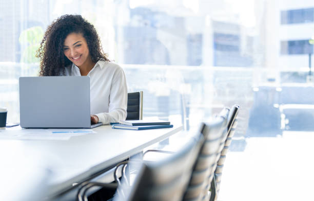 istock Happy Young woman working on a laptop computer in the office 2167964935