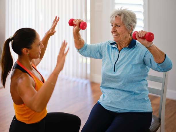 istock Physical Trainer Working with a Senior Aged Woman in a Home 2167965146