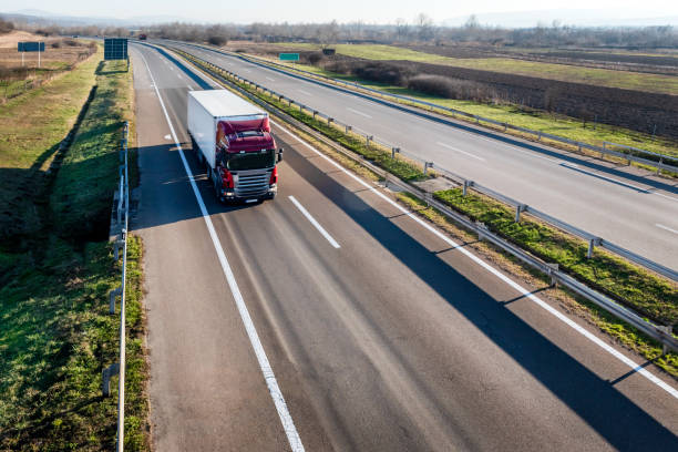 istock Red transportation Truck on road 2167968003