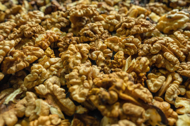 Peeled walnuts in close-up. Selective focus. Background image