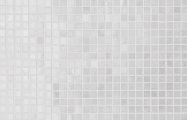 istock White tile wall chequered background bathroom texture. Ceramic brick wall and floor tiles mosaic background in bathroom and kitchen clean. Design pattern geometric with grid wallpaper decoration. 2167972751