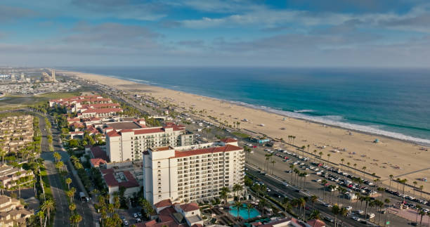istock Waves Lapping on the Huntington Beach Shore on a Sunny Day - Drone Shot 2167973466