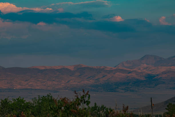 Beautiful sunset sky over the mountains silhouette
