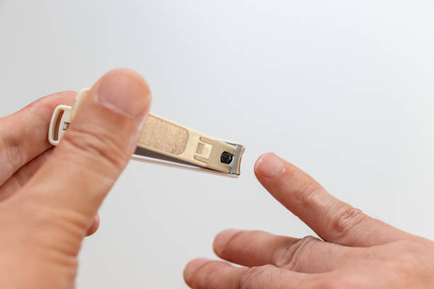 istock Cutting the pinky nail with nail clippers 2167984366