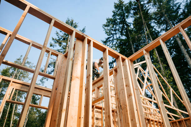 istock Construction Crew Putting Up Framing of New Home 2167986654