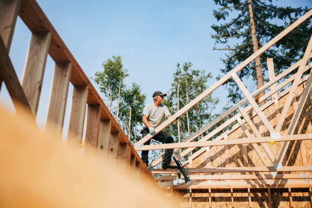 istock Construction Crew Putting Up Framing of New Home 2167986681
