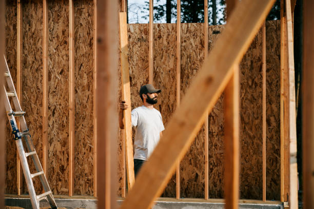 istock Construction Crew Putting Up Framing of New Home 2167986687