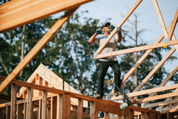 Construction Crew Putting Up Framing of New Home