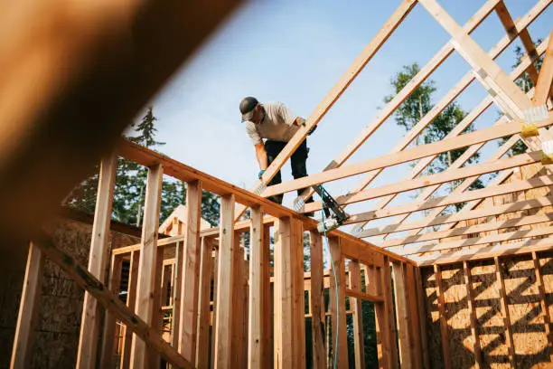 Construction Crew Putting Up Framing of New Home Construction Crew Putting Up Framing of New Home