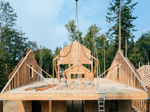 istock Construction Crew Putting Up Framing of New Home 2167986859