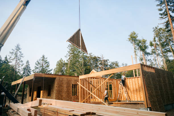 Construction Crew Putting Up Framing of New Home