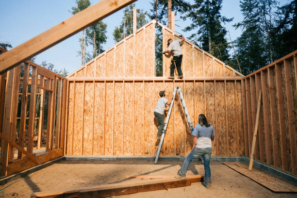 Construction Crew Putting Up Framing of New Home