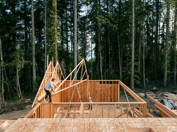 istock Construction Crew Putting Up Framing of New Home 2167987024